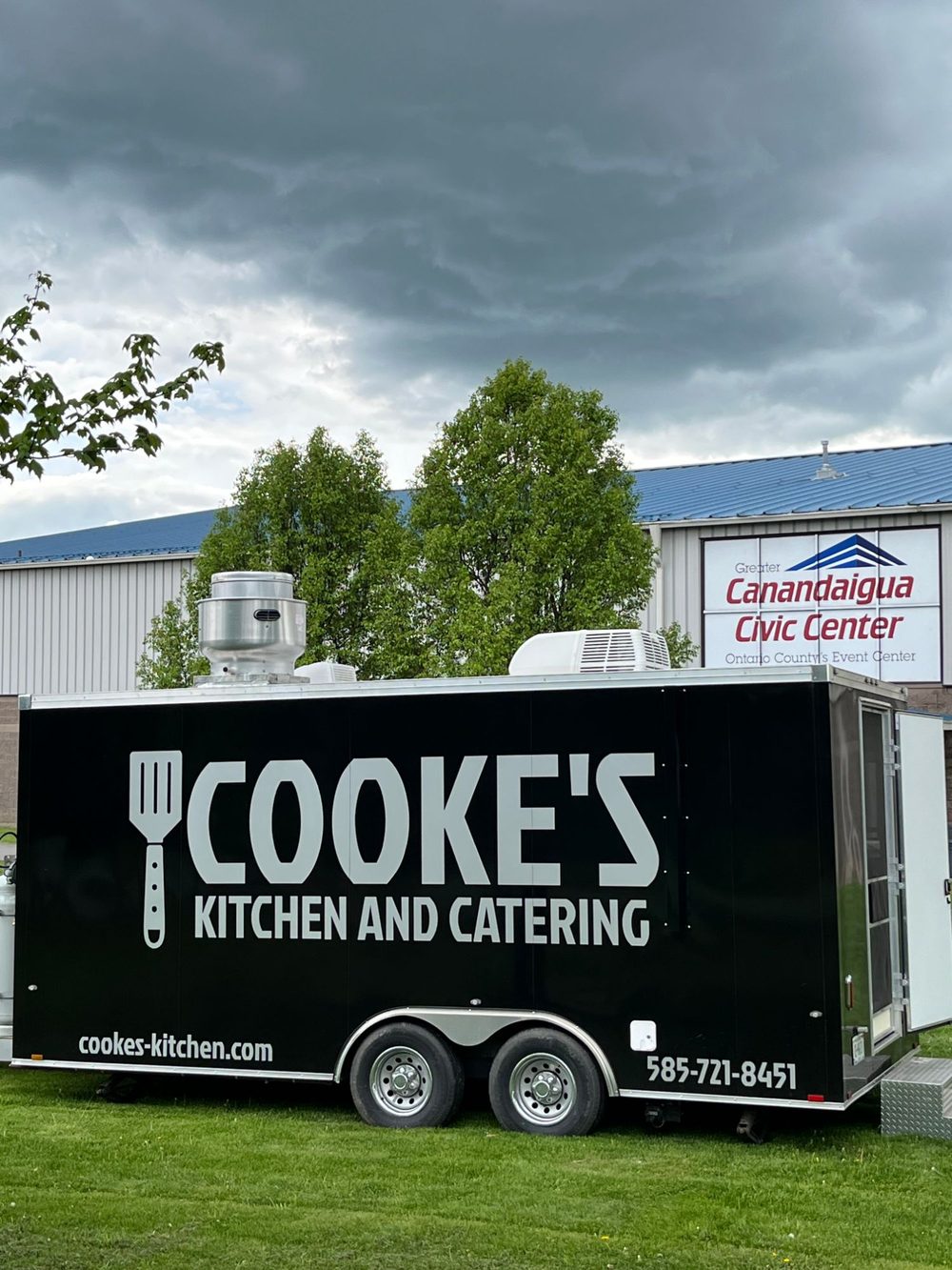 Cooke's Kitchen and Catering food truck parked in front of the Greater Canandaigua Civic Center