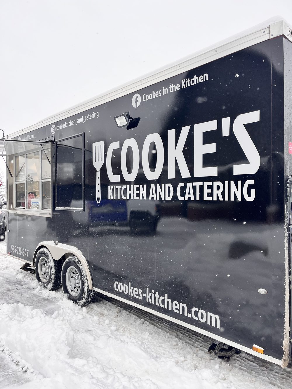 Cooke's Kitchen and Catering food truck serving at the Polar Plunge in the snow
